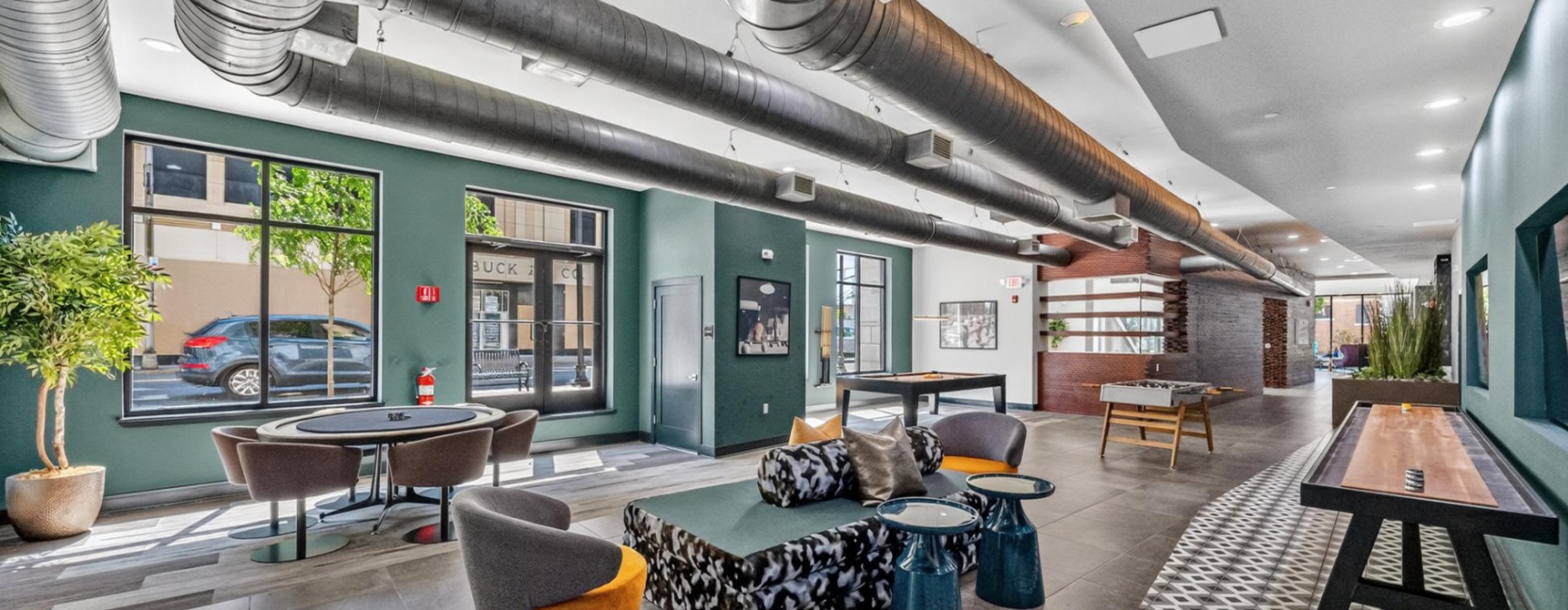 Amenity showing lounge area, poker table, and shuffleboard 